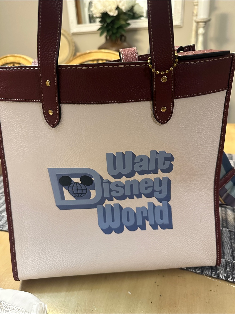 Coach Cream Tote with Burgundy Trim and Blue Walt Disney World Logo